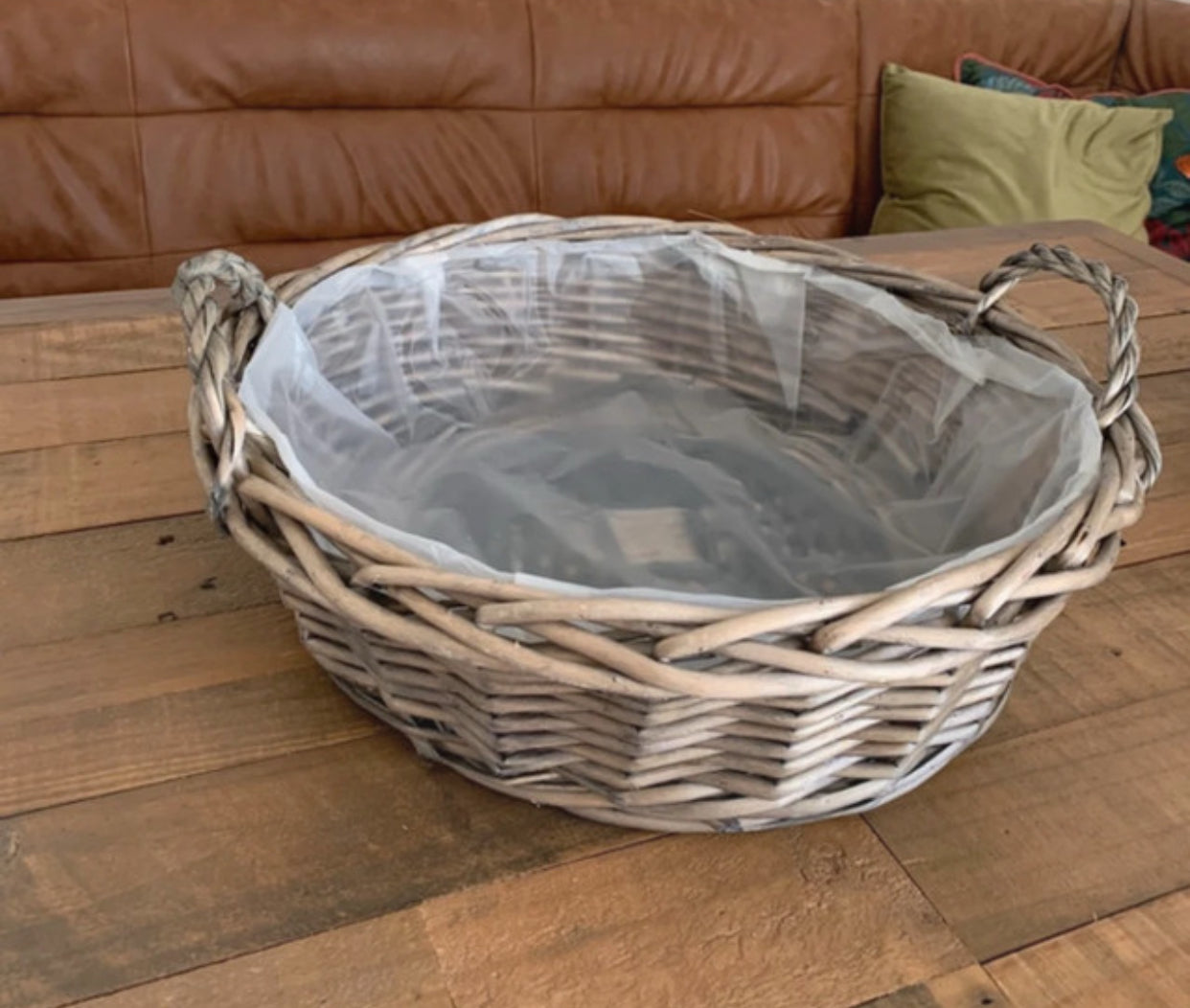 Large round antique wash wicker willow basket vegetable tray with thick plastic lining.