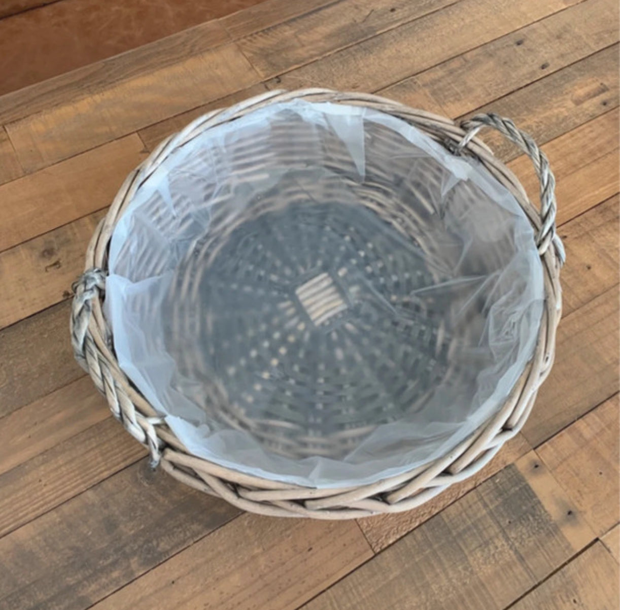 Large round antique wash wicker willow basket vegetable tray with thick plastic lining.