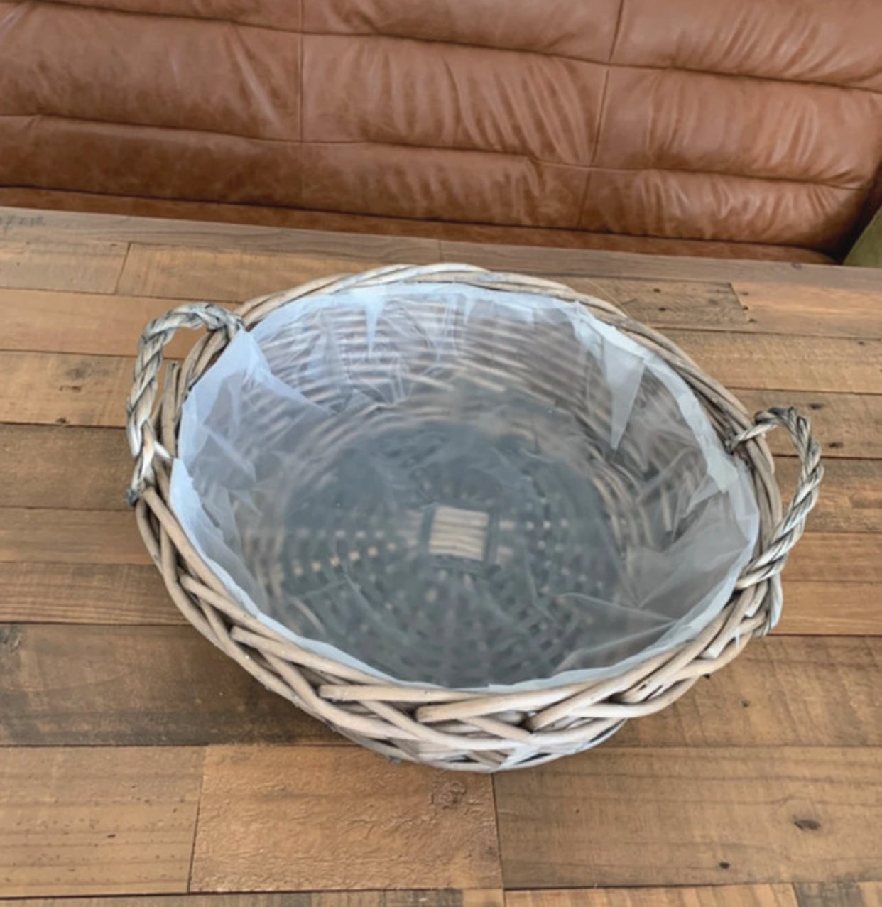 Large round antique wash wicker willow basket vegetable tray with thick plastic lining.